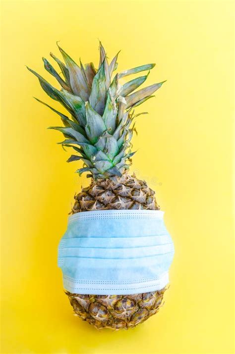 Pineapple Wearing Surgical Medical Mask On Yellow Background