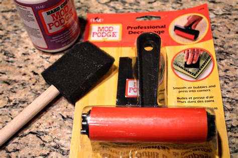 When it's time to remove your creation, spray it down with water to make peeling it off easier. edited Mod Podge Kitchen Cabinet liners (1)