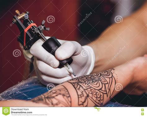 Tattoo Master Protective Gloves Make A Tattoo In Black Ink On The Hand