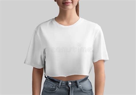 White Crop Top Mockup On A Girl In Jeans Isolated On Background Front