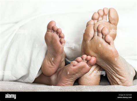 Mother And Daughter Feet In Bed Stock Photo Alamy