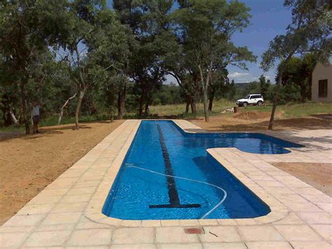 The cost to build a backyard pool with a lap lane varies with location, materials, topography, and the type of features you want. Backyard Landscaping Ideas-Swimming Pool Design ...