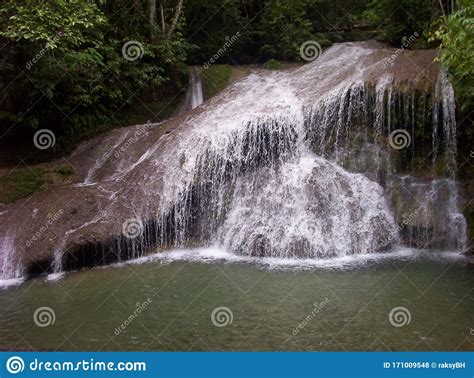 Scenic View Of Water Cascading From A Waterfalls Stock Photo Image Of