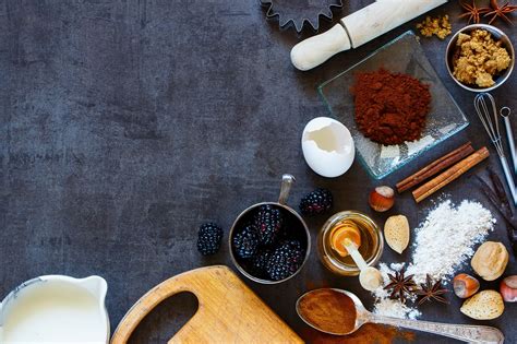 The essence of cooking lies within the ingredients. Baking ingredients background - Assortment of ingredients ...