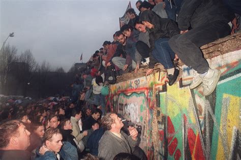 On A Memory Filled Date The Fall Of The Berlin Wall Stands Front And