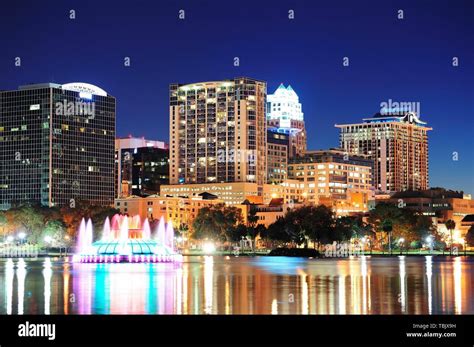 Orlando Downtown Skyline Panorama Over Lake Eola At Night With Urban