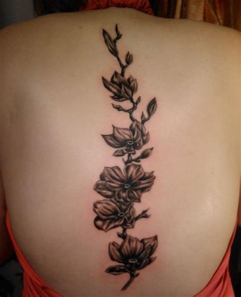 Black Flowers Spine Tattoo