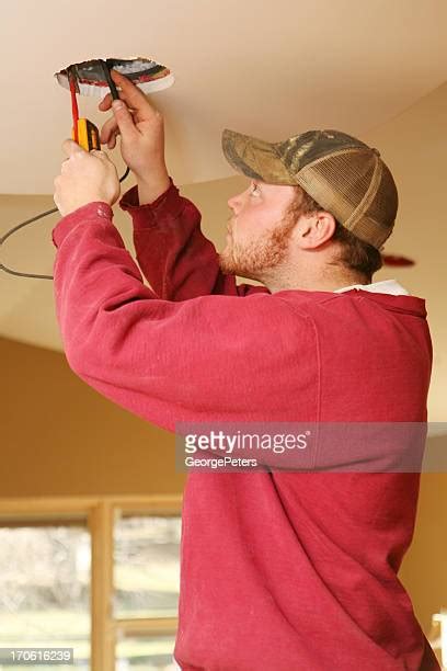 Electrician Installing Lights Photos And Premium High Res Pictures