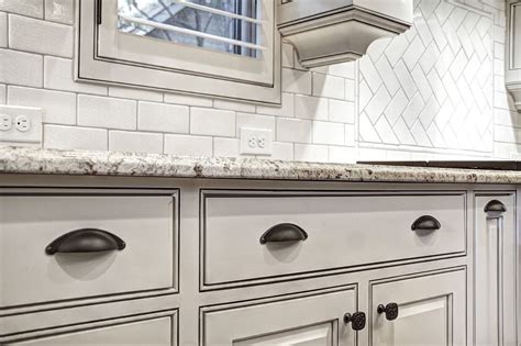 Tumbled white bronze find the door, cabinet and bath hardware that you need by searching through our products in tumbled white bronze (twb) finish. Off White Cabinets with Glaze - Oil Rubbed Bronze Hardware - Crackled Hand Clay Tile Backsplash ...