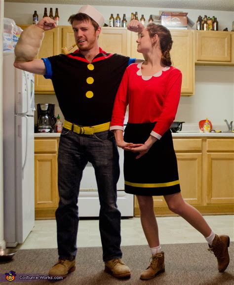 Popeye costume is a black sailor's shirt, blue pants with yellow belt, a sailor's hat, and his signature tobacco pipe. Popeye and Olive Oyl Costume