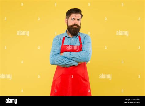 Commercial Kitchen Entrepreneur In His Modern Look Bearded Chef Or Waiter Wearing Red Apron