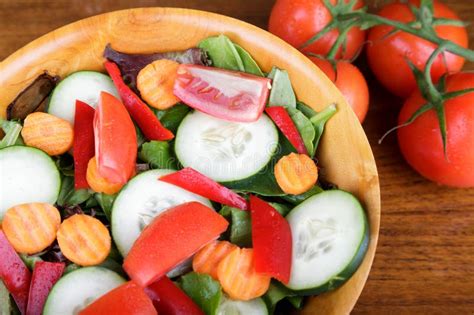 Large Mixed Salad In Wood Bowl With Fresh Tomatoes Stock Photo Image
