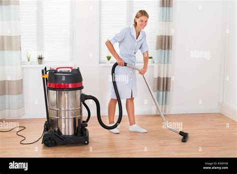 Female Maid With Vacuum Cleaner Stock Photo Alamy