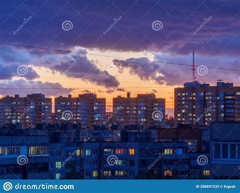 Evening City Illumination And Bright Dramatic Sky At Sunset Place For