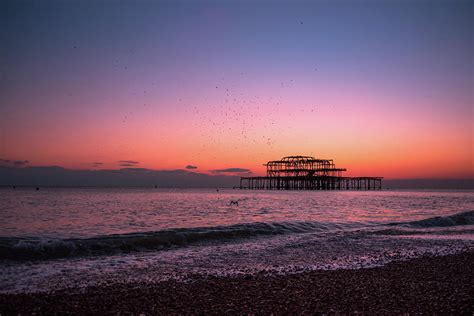 Brighton Pier At Sunset Photograph By Marius Comanescu Fine Art America