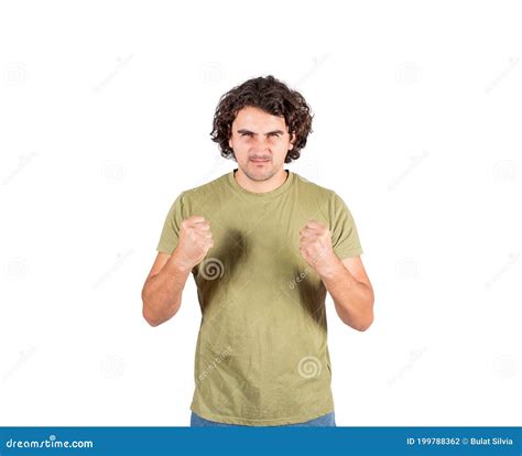 Portrait Of Furious Young Man Long Curly Hair Style Keeps Fists