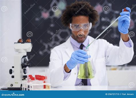 Be Very Very Careful A Male Scientist Conducting An Experiment In A