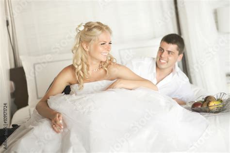 Lovely Married Couple Teasing Each Other Lying On Bed Buy This Stock