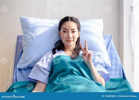 Asian Female Patient Happy Has Improved Symptoms On Hospital Bed Stock Image Image Of