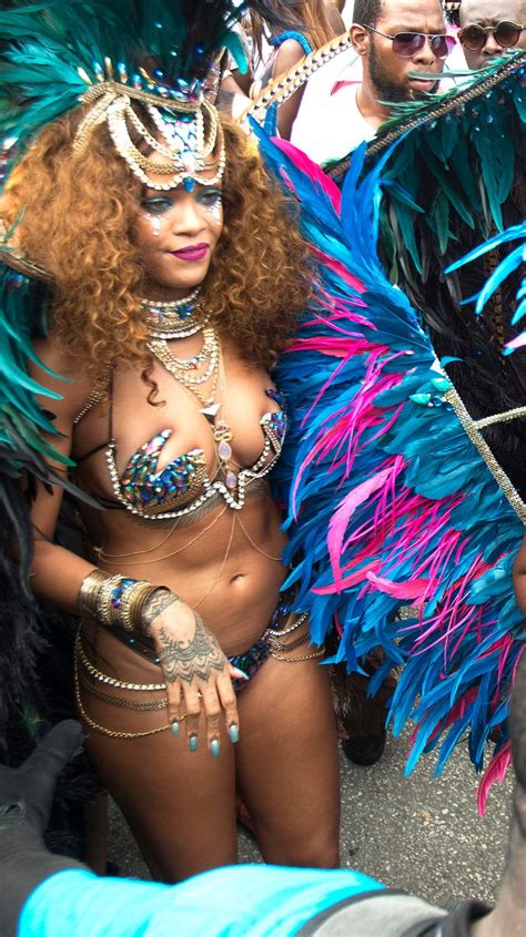 rihanna is pictured wearing a colorful costume during barbados annual kadooment day parade