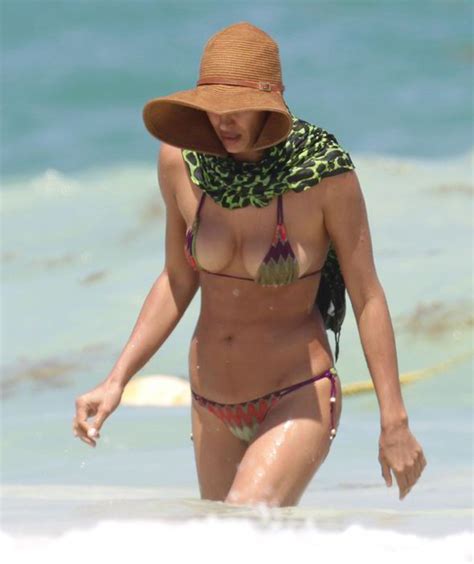Irina Shayk Displays Her Ample Chest In Tiny Patterned Bikini As She