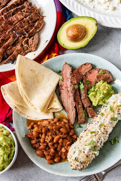 An Image With A Full Mexican Dinner For Cinco De Mayo With Charro Beans