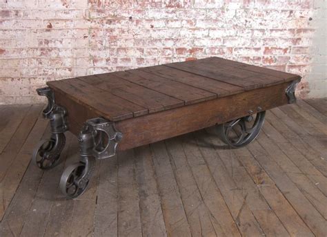 A wrought iron coffee table most often has a base fashioned from the metal with a glass tabletop. Vintage Industrial Wood and Cast Iron Nutting Cart ...