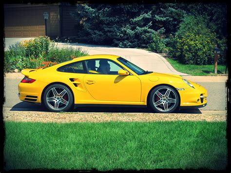 A Pair Of Porsche Enthusiasts And Their Speed Yellow 997 Turbo