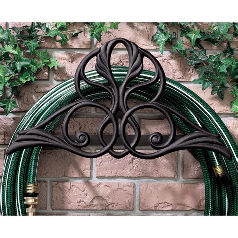 Keep hoses of any length organized with wall mounted hose hangers, hose stands, or hose reels. 17 Garden Hose Storage Solutions | HGTV