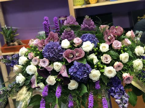Casket Spray Sympathy Flowers In Purple White And Blue Sympathy