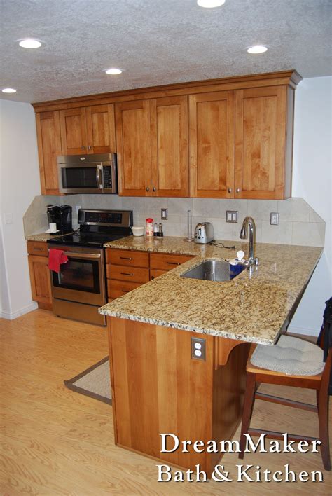Wood kitchen island countertop provides a warm, organic landing surface in a kitchen whatever its style is and create timeless look. Granite countertops and stainless steel sink. | Kitchen ...