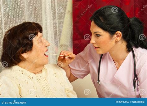 Doctor Examine Elderly For Sore Throat Stock Image Image Of Examine