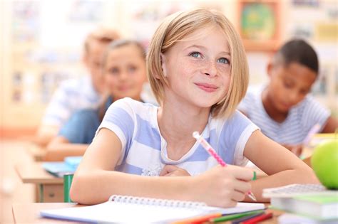 Cute Schoolgirl In Classroom On Lesson Advanced Behavioral Health Services