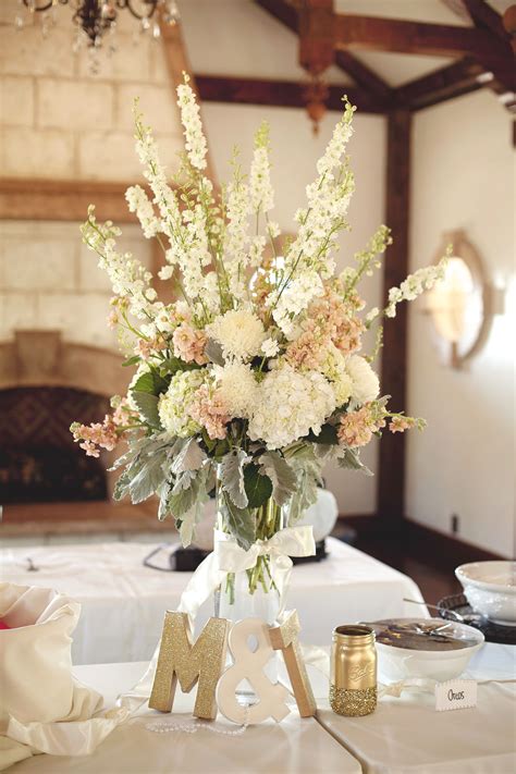 Today, the average cost of a wedding is around £30,000 which is beyond the reach of most couples. tall ivory blush wedding centerpiece arrangement utah ...