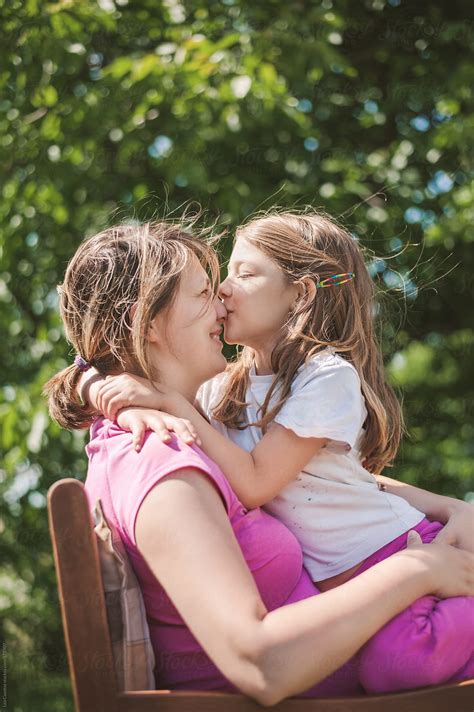 Mother And Daughter Hugging And Cuddling Up Together Girl Kissing Her Mother S Nose By Lea Csontos