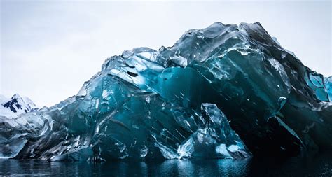 Glassy Blue Iceberg Goes Belly Up