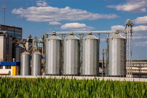 Premium Photo Agricultural Silos On The Background Of The Field