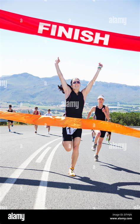 Runner Crossing Race Finish Line Stock Photo 56530061 Alamy