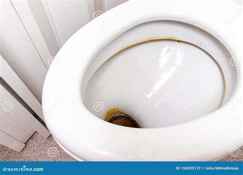 Dirty Unhygienic Toilet Bowl With Limescale Stain At Public Restroom Close Up Stock Photo