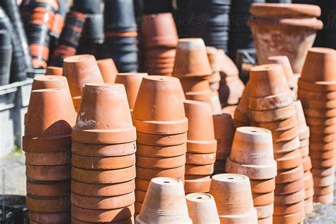 Small Terracotta Pots Stacked Outdoors By Stocksy Contributor