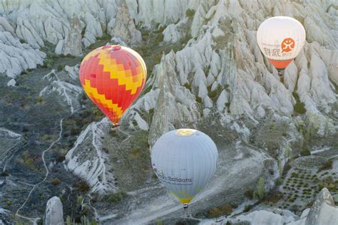 Hot Air Balloon Flying Over Rock Landscape At Cappadocia Editorial