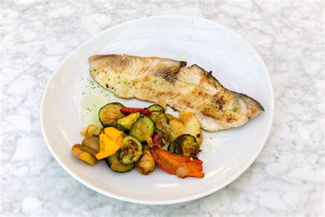 A Portion Grilled Swordfish With Vegetables On A White Plate Creative