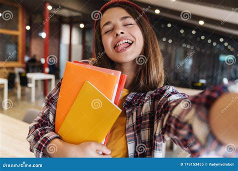 Image Of Amusing Girl Taking Selfie While Holding Exercise Books Stock Image Image Of