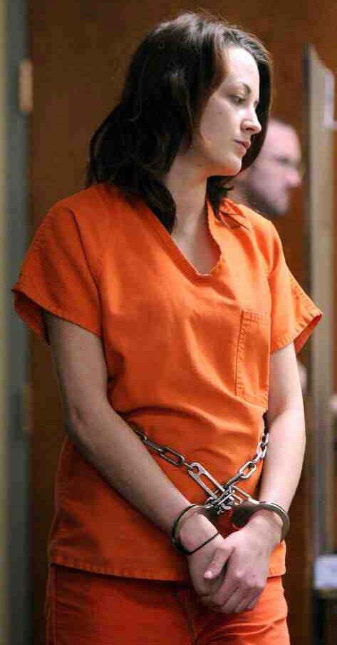 Woman Handcuffed And Chained At The Court Prison Jumpsuit Asian Model Orange Jumpsuit