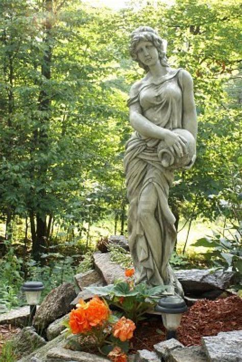 A Beautiful Garden Statue Of A Woman And A Vase Garden Art