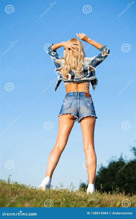 Beautiful Blonde Woman Dressed In A Denim Jacket And Shorts Stock Photo Image Of Jeans Model