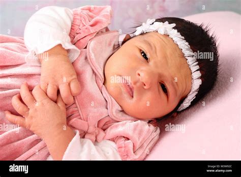 8 Day Old Ethnic Baby Girl Happy And Relaxing In Nursery Newborn
