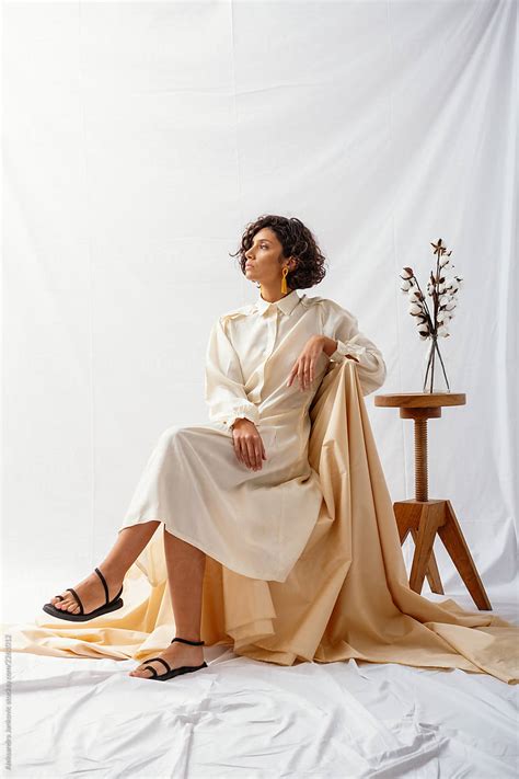 Portrait Of Fashion Model Wearing White Silk Dress In The Studio By Stocksy Contributor