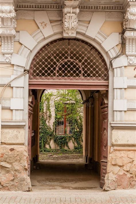An Old Gate With A Corridor Leading To The Courtyard Of The House Stock