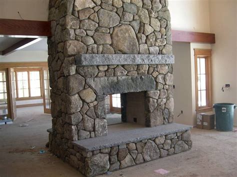 pass through fireplace pass through fieldstone fireplace with antique granite lintel and